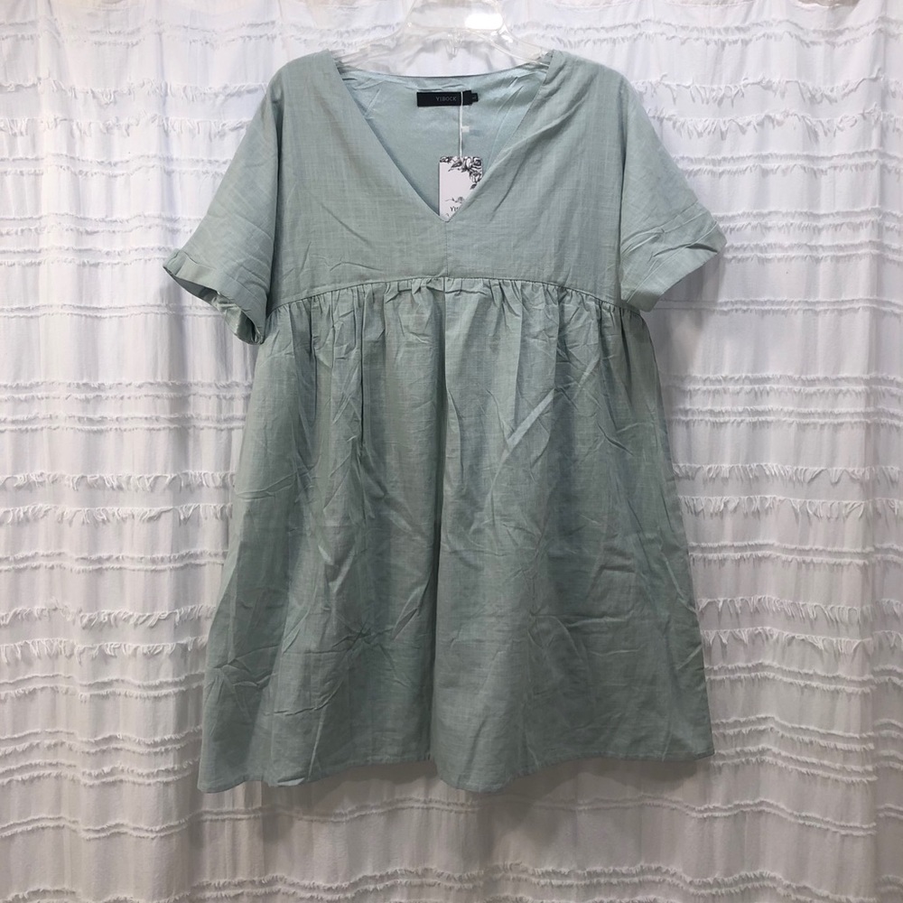 Babydoll dress in a sage green/turquoise.